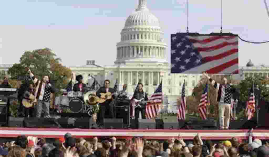 Comedians Jon Stewart, right, and Stephen Colbert, left, perform during their Rally to Restore Sanity and/or Fear on the National Mall in Washington, Saturday, Oct. 30, 2010. (AP Photo/Carolyn Kaster)