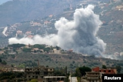 Smoke rises from the southern Lebanese village of Kfar Kila, near the border with Israel, Sept. 20, 2024.