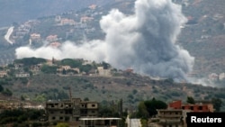 Smoke rises from the confederate  Lebanese colony   of Kfar Kila, adjacent   the borderline  with Israel, Sept. 20, 2024.