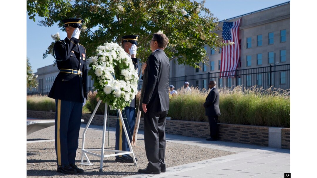 Defense Secretary Ash Carter attends a wreath ceremony during a memorial for the 14th anniversary of the September 11th attacks, Sept. 11, 2015, at the Pentagon.