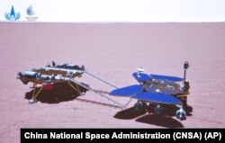 In this artist's rendering made available by the China National Space Administration (CNSA) on Saturday, May 22, 2021, China's Zhurong rover is depicted on the surface of Mars. China's first Mars rover has driven down from its landing platform and is now roaming the surface of the red planet, China's space administration said Saturday. (CNSA via AP)