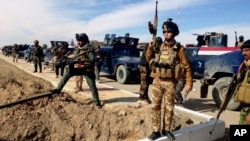 Lực lượng an ninh Iraq chuẩn bị tấn công những cứ điểm al-Qaida ở Ramadi, ngày 2 tháng 2, 2014.