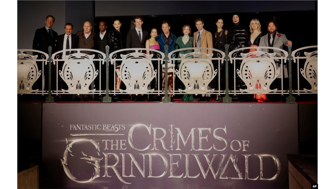 From left, Lionel Wigram,David Heyman, David Yates,William Nadylan,Claudia Kim,Callum Turner, Zoe Kravitz, Jude Law, J.K Rowling, Eddie Redmayne,Katherine Waterston,Ezra Miller,Alison Sudol and Dan Fogler pose at the world premiere of the film "Fantastic