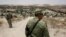 Members of the Mexican National Guard patrol the border with the United States, as seen from Anapra neighborhood, on the outskirts of Ciudad Juarez, Mexico, July 24, 2019. 