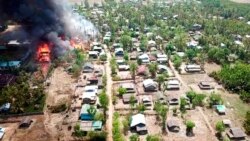 FILE - In this photo released by the Myanmar Army, a fire burns May 16, 2020, in the predominantly ethnic Rakhine village of Let Kar in Rakhine State's Mrauk-U township, western Myanmar.