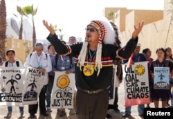 Representatives of different indigenous groups from various countries protest during the UN Climate Change Conference 2016 (COP22) in Marrakech, Morocco, Nov. 17, 2016.