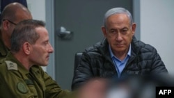 This screen grab taken from a handout video released by the Israeli government press office shows Prime Minister Benjamin Netanyahu attending a meeting in the command center of the defense ministry in Tel Aviv on October 26, 2024, a