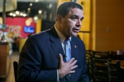 FILE - U.S. Rep. Henry Cuellar (D-TX) gives an interview in Laredo, Texas, Oct. 9, 2019.