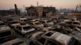 Cars are left charred inside a dealership in the aftermath of the Eaton fire in Altadena, California, Jan. 10, 2025.