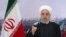 In this photo released by the Iranian president's office, President Hassan Rouhani addresses the nation in a televised speech in Tehran, Feb. 10, 2021.