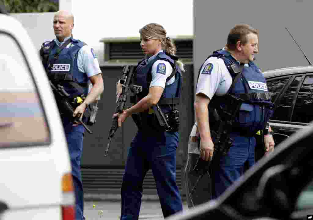 Armed police patrol outside a mosque in central Christchurch, New Zealand, March 15, 2019. A witness says many people have been killed in a mass shooting at a mosque in the New Zealand city of Christchurch.