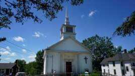 Members of 164-year-old Waldoboro United Methodist Church chat following a service, Sunday, June 20, 2021, in Waldoboro, Maine. (AP Photo/Robert F. Bukaty)