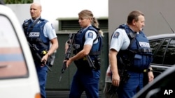 Armed police patrol outside a mosque in central Christchurch, New Zealand, March 15, 2019. A witness says many people have been killed in a mass shooting at a mosque in the New Zealand city of Christchurch.