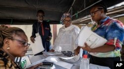 INEC workers collate results manually at a center in Lagos, Feb. 26, 2023.