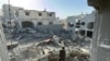 A Palestinian inspects the damage after an overnight Israeli airstrike in Beit Lahia the northern Gaza Strip on October 27, 2024 amid the ongoing war in the Palestinian territory between Israel and Hamas.