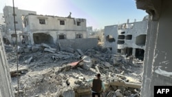 A Palestinian inspects the damage after an overnight Israeli airstrike in Beit Lahia the northern Gaza Strip on October 27, 2024 amid the ongoing war in the Palestinian territory between Israel and Hamas.