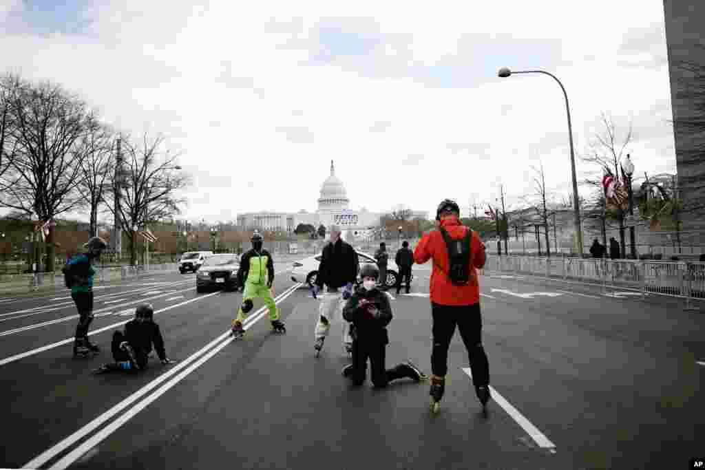 Rollerbladers roll around Washington near the Capitol as security is increased ahead of the inauguration of President-elect Joe Biden and Vice President-elect Kamala Harris in Washington, D.C.
