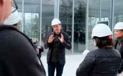 Architect Winy Maas speaks to reporters on the roof of the new Depot Boijmans Van Beuningen in Rotterdam, Netherlands, Thursday Sept. 24, 2020.