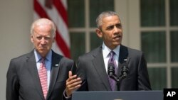 President Barack Obama, accompanied by Vice President Joe Biden, speaks in the Rose Garden of the White House in Washington, July 1, 2015. 