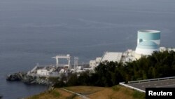 Shikoku Electric Power's Ikata nuclear plant is pictured near the water in Ikata, Japan, October 2, 2018. Picture taken October 2, 2018. REUTERS/Mari Saito