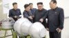 North Korean leader Kim Jong Un, center, provides guidance on a nuclear weapons program in this undated photo released by North Korea's Korean Central News Agency (KCNA) in Pyongyang, Sept. 3, 2017.
