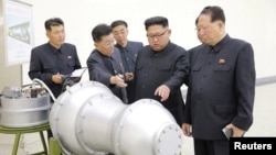 North Korean leader Kim Jong Un, center, provides guidance on a nuclear weapons program in this undated photo released by North Korea's Korean Central News Agency (KCNA) in Pyongyang, Sept. 3, 2017. KCNA via REUTERS