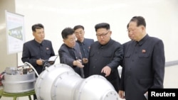 North Korean leader Kim Jong Un, center, provides guidance on a nuclear weapons program in this undated photo released by North Korea's Korean Central News Agency (KCNA) in Pyongyang, Sept. 3, 2017. KCNA via REUTERS 