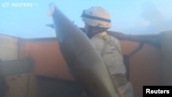 Screen grab from Reuters video of footage from IS fighter's helmet-camera.