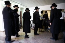 Ultra-orthodox Jews line up to vote in Bnei Brak, Israel, Sept. 17, 2019.