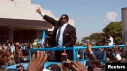 Malawi celebrates its independence anniversary with speeches, parades, football, prayers and a new president, Peter Mutharika, who waved to crowds during his inauguration a month ago.