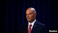 Acting director of the Immigration and Customs Enforcement agency (ICE) Ronald Vitiello listens as U.S. Vice President Mike Pence delivers remarks at ICE headquarters in Washington, July 6, 2018. 