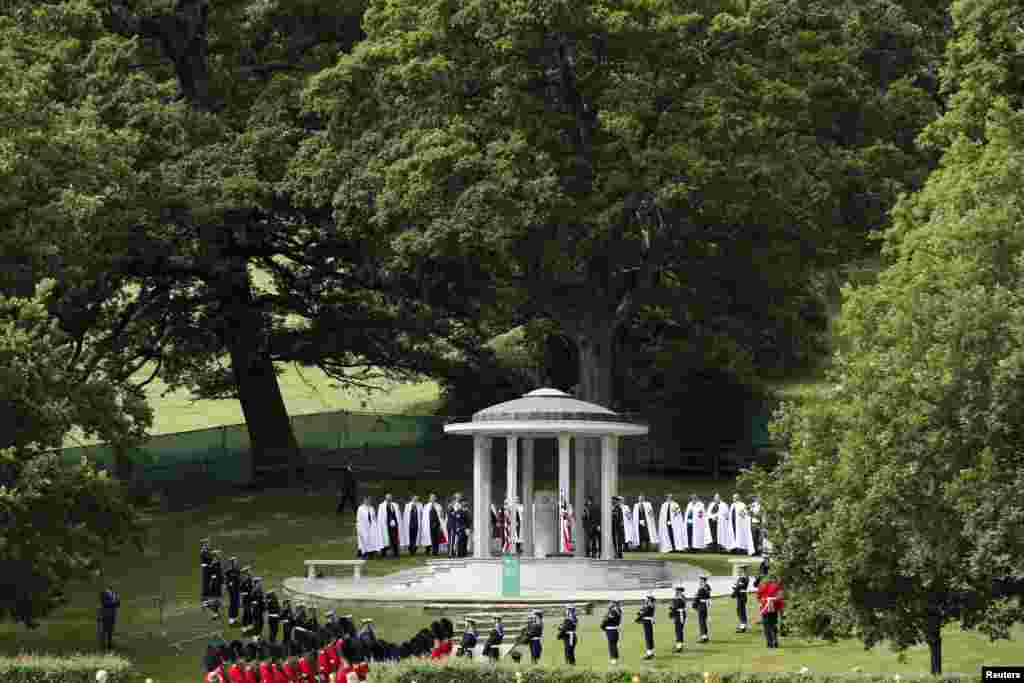 Soldiers stand next to a Magna Carta memorial during an event marking the 800th anniversary of the Magna Carta in Runymede, Britain.