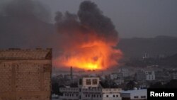 Smoke billows from a fire at a Houthi-controlled military site after it was hit by a Saudi-led airstrike in San'aa, Yemen, June 3, 2015. 