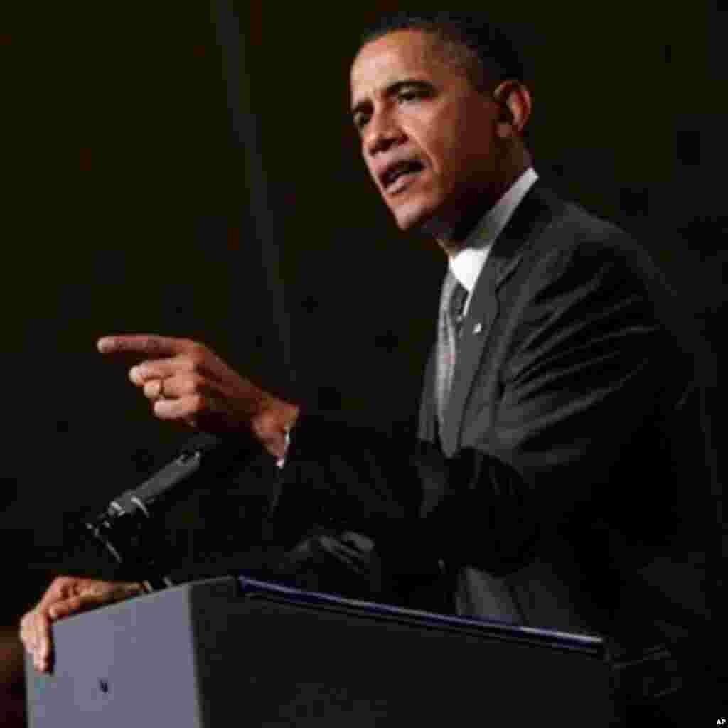 Shugaba Barack Obama, yana kyamfe ma 'yan jam'iyyarsa.