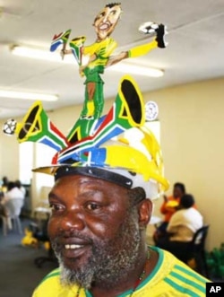 South African fans celebrate the games with makarapas - colorful hats made from everyday materials