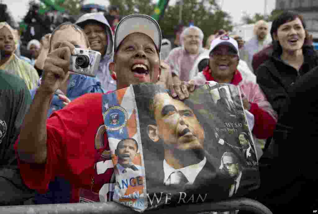 Supporters cheer as President Barack Obama speaks at a campaign event at rainy Cleveland State University in Ohio, Oct. 5, 2012. 