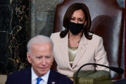 U.S. Vice President Kamala Harris looks on as U.S. President Joe Biden addresses a joint session of Congress at the U.S. Capitol in Washington, April 28, 2021.