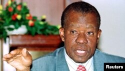 FILE - Former president of Botswana Ketumile Masire, speaks to the media at a news conference in Nairobi, Kenya, May 16, 2000. 