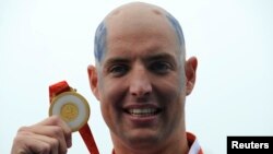 Perenang Belanda Maarten van der Weijden saat meraih emas pada Olimpiade 2008 di Beijing untuk nomor 10 km putra (foto: dok). 