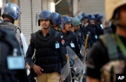 FILE - Pakistani police officers in Peshawar, Pakistan, Oct. 22, 2015.