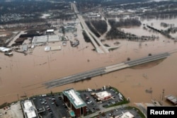 An aerial view from a Missouri National Guard UH-60 Black Hawk helicopter shows the effects of flooding in Pacific, Missouri, Dec.30, 2015.