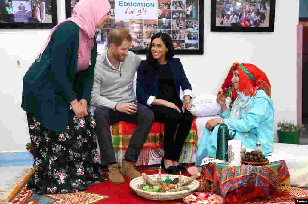 Britain&#39;s Prince Harry and Meghan, Duchess of Sussex, attend a Henna ceremony as they visit a boarding house for girls run by the Moroccan NGO &#39;Education for All&#39; in Asni, Morocco.