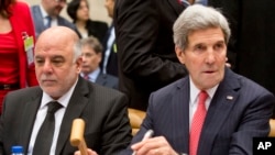 Ngoại trưởng Hoa Kỳ John Kerry (phải) trong phiên họp cấp cao về chiến dịch chống nhóm Nhà nước Hồi giáo tại Brussels, 3/12/14