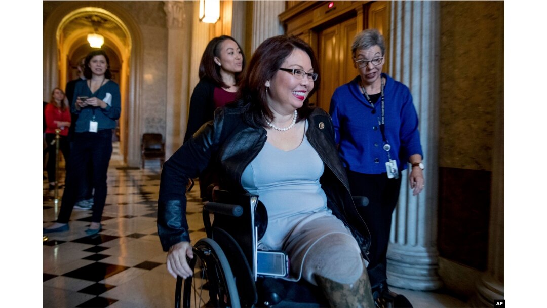 FILE - Sen. Tammy Duckworth, D-Ill. arrives for a closed-door Democratic policy luncheon on Capitol Hill in Washington.