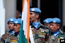 Peacekeepers from 41 different national contingents that make up the United Nations Interim Force in Lebanon (UNIFIL), stand at attention during a ceremony to mark the 40th anniversary of its peacekeeping presence in southern Lebanon, at the mission headquarters in the coastal town of Naqoura, Lebanon, March 19, 2018.