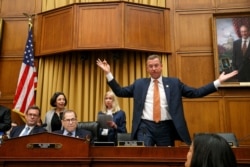 Rep. Doug Collins, R-Ga., ranking member on the House Judiciary Committee, (r), throws his arms up in the air in frustration after a one-minute recess is called shortly before the hearing in the questioning of Corey Lewandowski ends, Sept. 17, 2019.