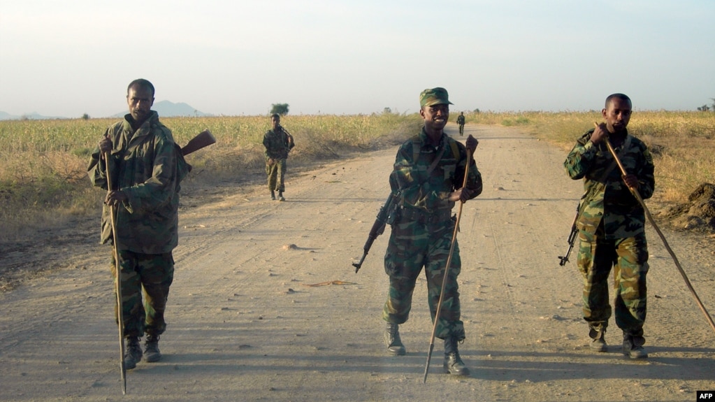 FILE - Ethiopian soldiers check for landmines on a road leading to the border town of Badme, Nov. 5, 2008. 