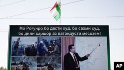 A propaganda poster for the Rogun dam project outside of Dushanbe features Tajikistan's president and builder in chief Emomalii Rahmon, October 1, 2011.