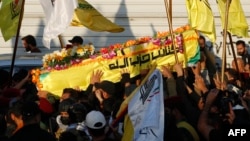 د ایران ملاتړ لرونکې کتایب حزب الله ډلې د لوړپوړي قومندان الساعدي مړی لېږدول کیږي چې په بغداد کې د امریکا په هوايي برید کې ووژل شو.
