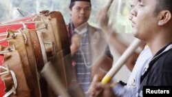 Malaysians of the Mandailing ethnic group perform Gordang Sambilan or Nine Great Drums, near Kuala Lumpur, June 27, 2012.